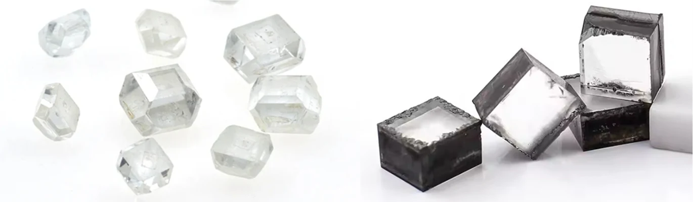 Rough HPHT diamond crystals beside darker CVD-grown diamond plates