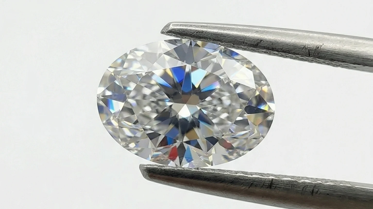 Macro view of an oval diamond showing its facet pattern